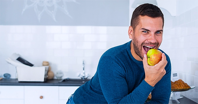 A man eating an apple | Trainest