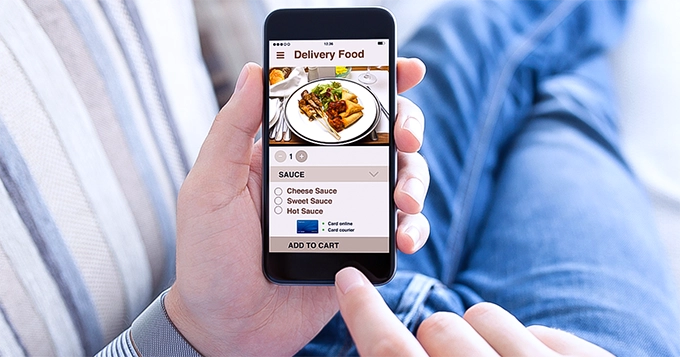 Someone ordering food on their phone | Trainest