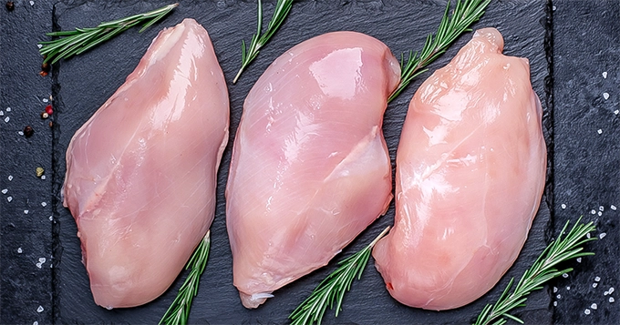 Three pieces of raw chicken breast | Trainest