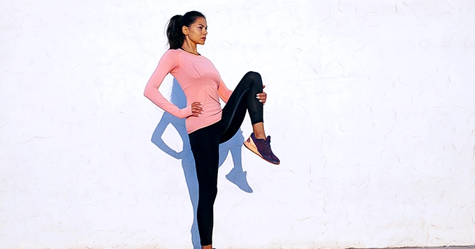 A fit woman stretching | Trainest