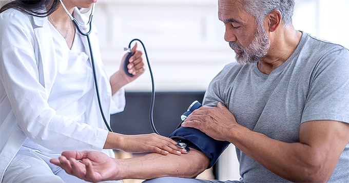 A fit, old man getting his blood pressure checked | Trainest