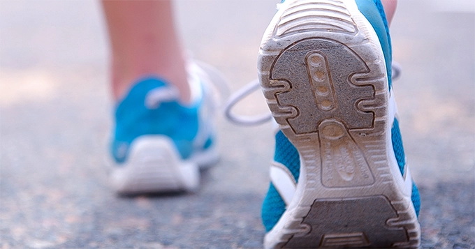 Close-up of shoes while walking | Trainest