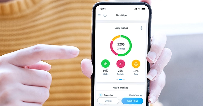 Someone using a nutrition app to track their meal | Trainest 