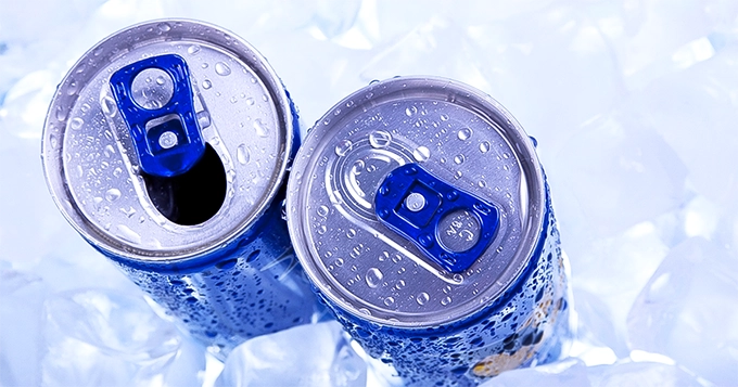 Two cans of energy drink in ice | Trainest