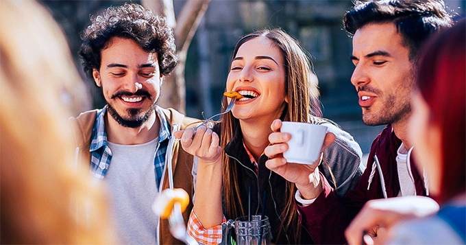 People enjoying eating together | Trainest 