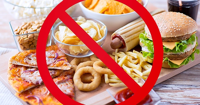 A board of junk foods with "no" sign in red | Trainest 