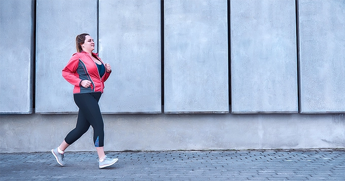 A heavy set woman jogging | Trainest 