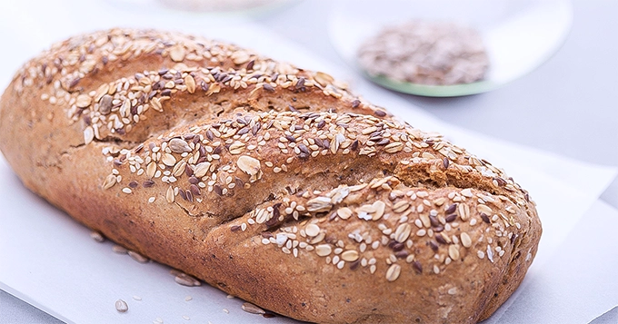 A whole loaf of oat bread | Trainest 