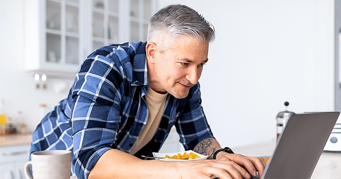 A man using his laptop | Trainest 