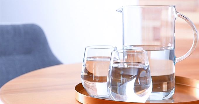 A pitcher and glasses of water | Trainest 