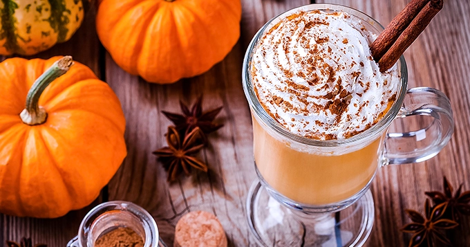 A cup of pumpkin spice latte | Trainest
