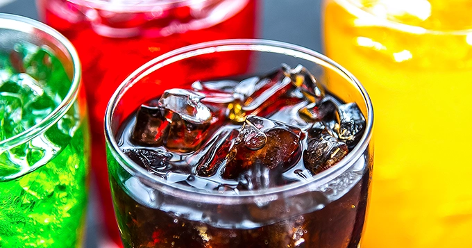 A colorful selection of soda in different glasses | Trainest 