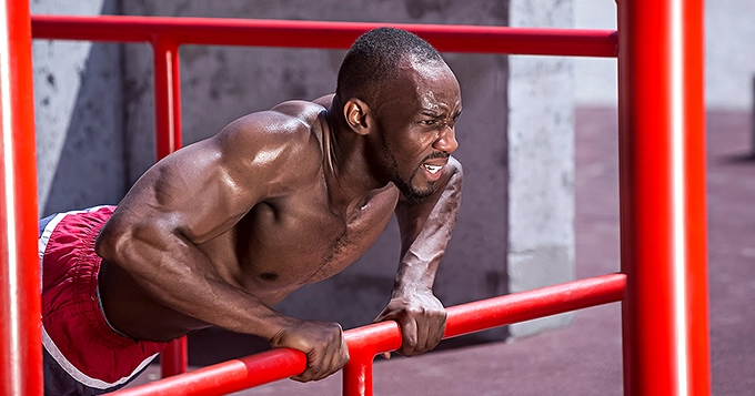 A man engaged in vigorous exercise | Trainest 