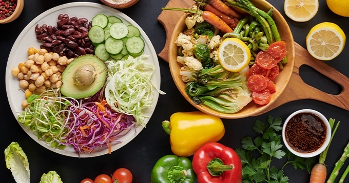 A table filled with plant-based foods | Trainest
