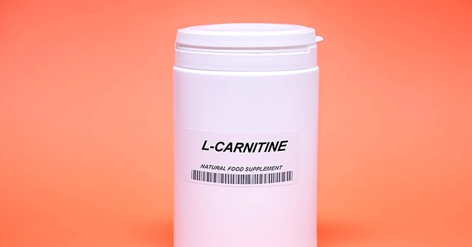 A supplement tub of L-Carnitine powder | Trainest
