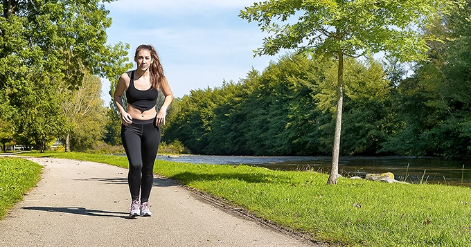 Someone walking as an exercise at the park | Trainest