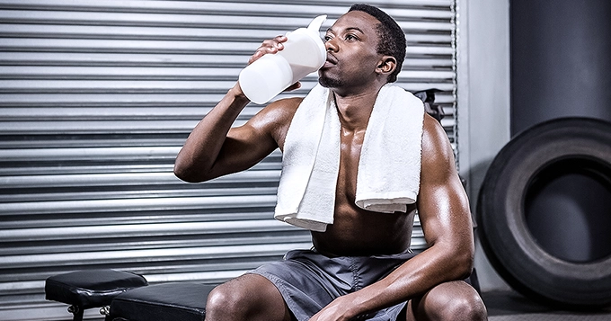 Someone drinking a protein shake after a workout | Trainest