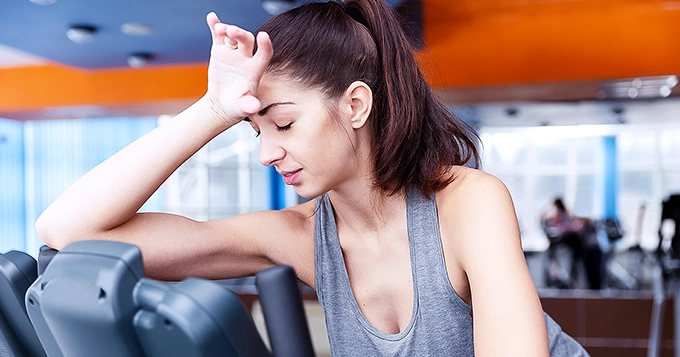 Someone looking tired at the gym | Trainest